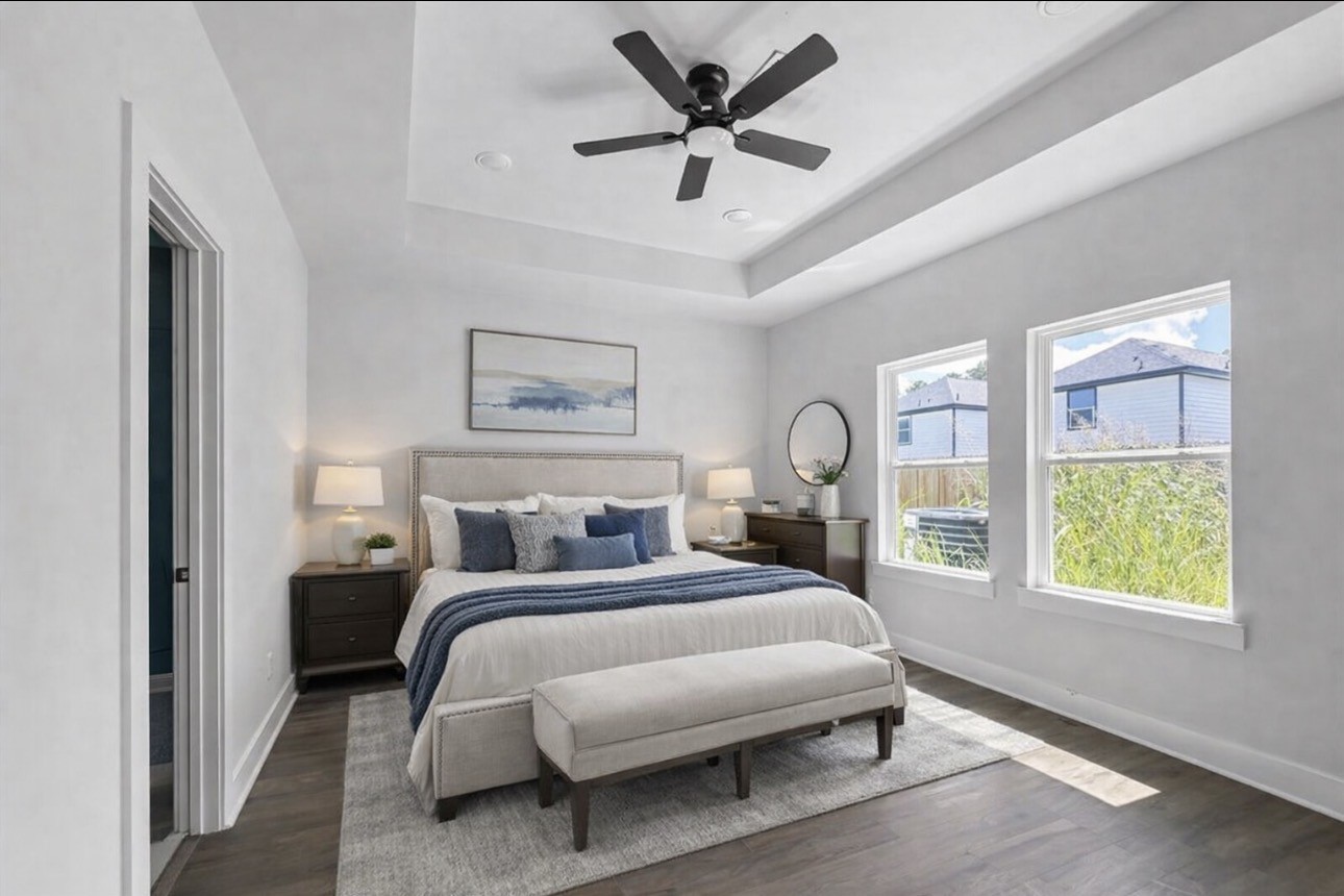 6010 Bobby Burns Street Houston, TX 77028 - Photo 12 of 22 a bed room with a bed and a large window