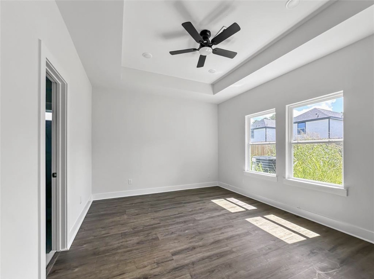 6010 Bobby Burns Street Houston, TX 77028 - Photo 13 of 22 wooden floor in an empty room with a window