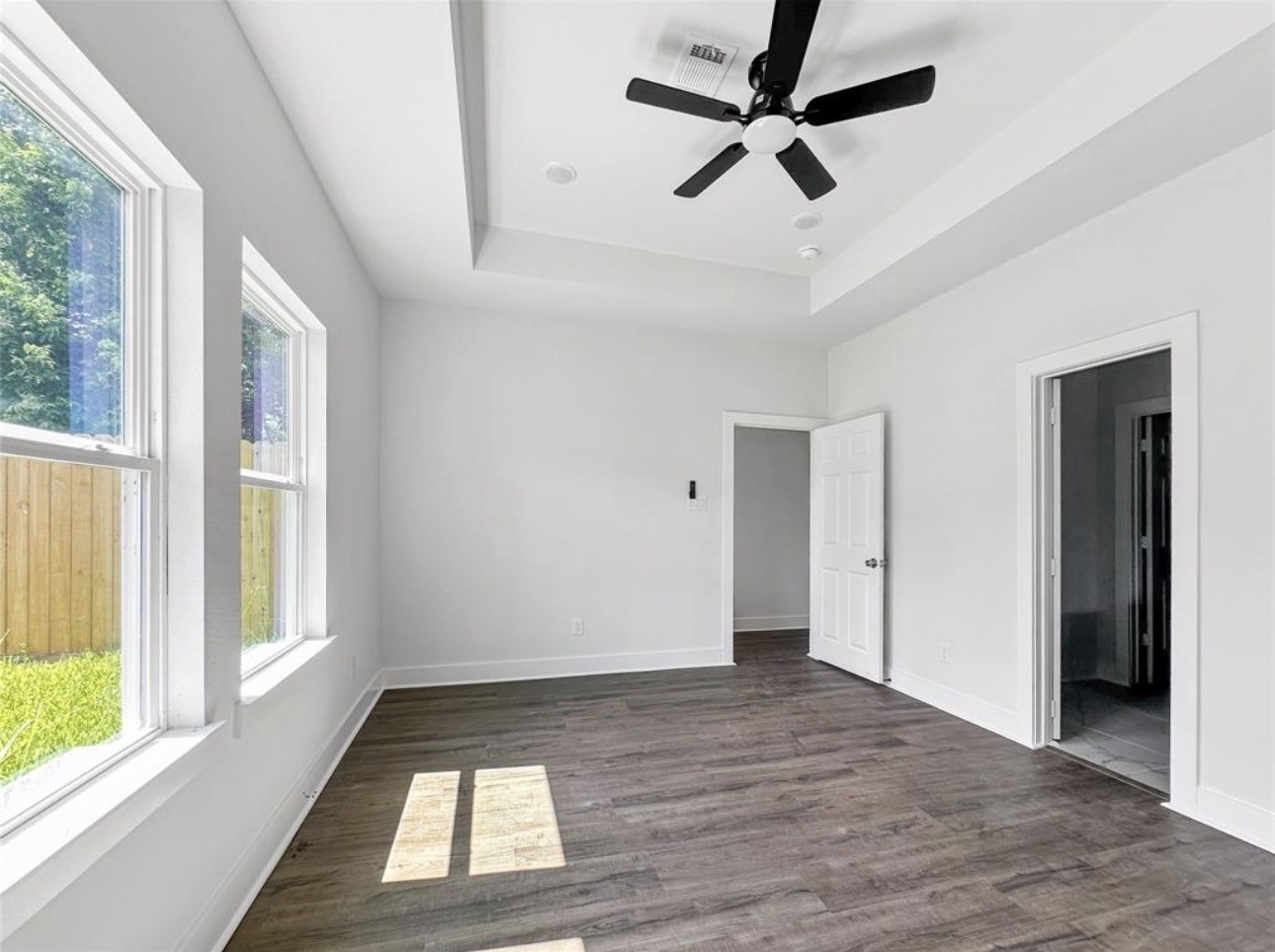 6010 Bobby Burns Street Houston, TX 77028 - Photo 16 of 22 a view of empty room with wooden floor and fan