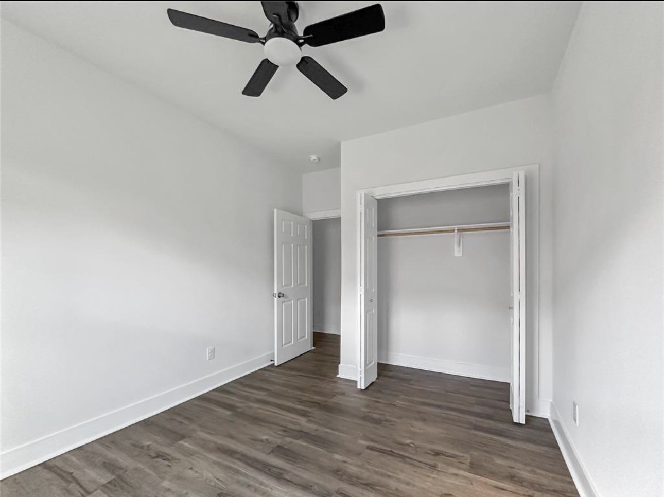 6010 Bobby Burns Street Houston, TX 77028 - Photo 19 of 22 an empty room with wooden floor closet and windows