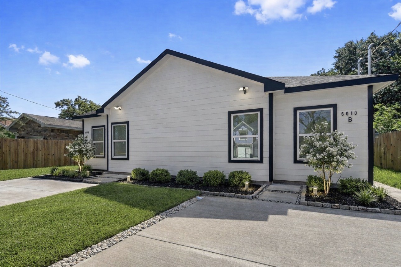 6010 Bobby Burns Street Houston, TX 77028 - Photo 3 of 22 a front view of a house with a garden and plants