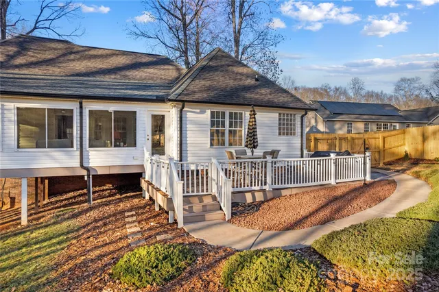 a view of a house with wooden floor and a yard
