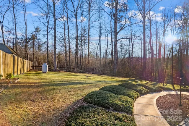 a swimming pool with outdoor seating and yard