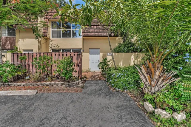 a view of a house with a street