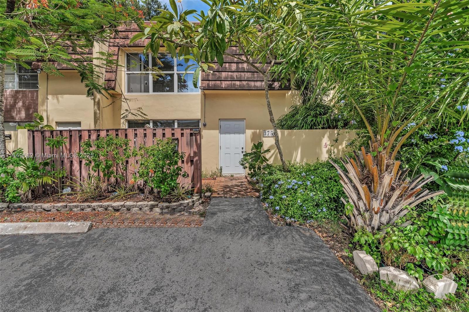 a view of a house with a street