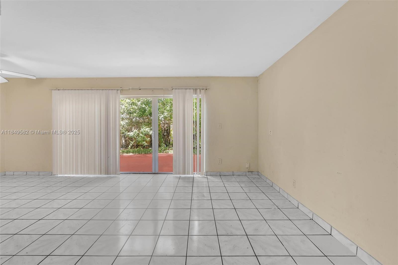 3750 Southwest 60th Terrace, Unit 1 Davie, FL 33314 - Photo 11 of 56 a view of an empty room and window