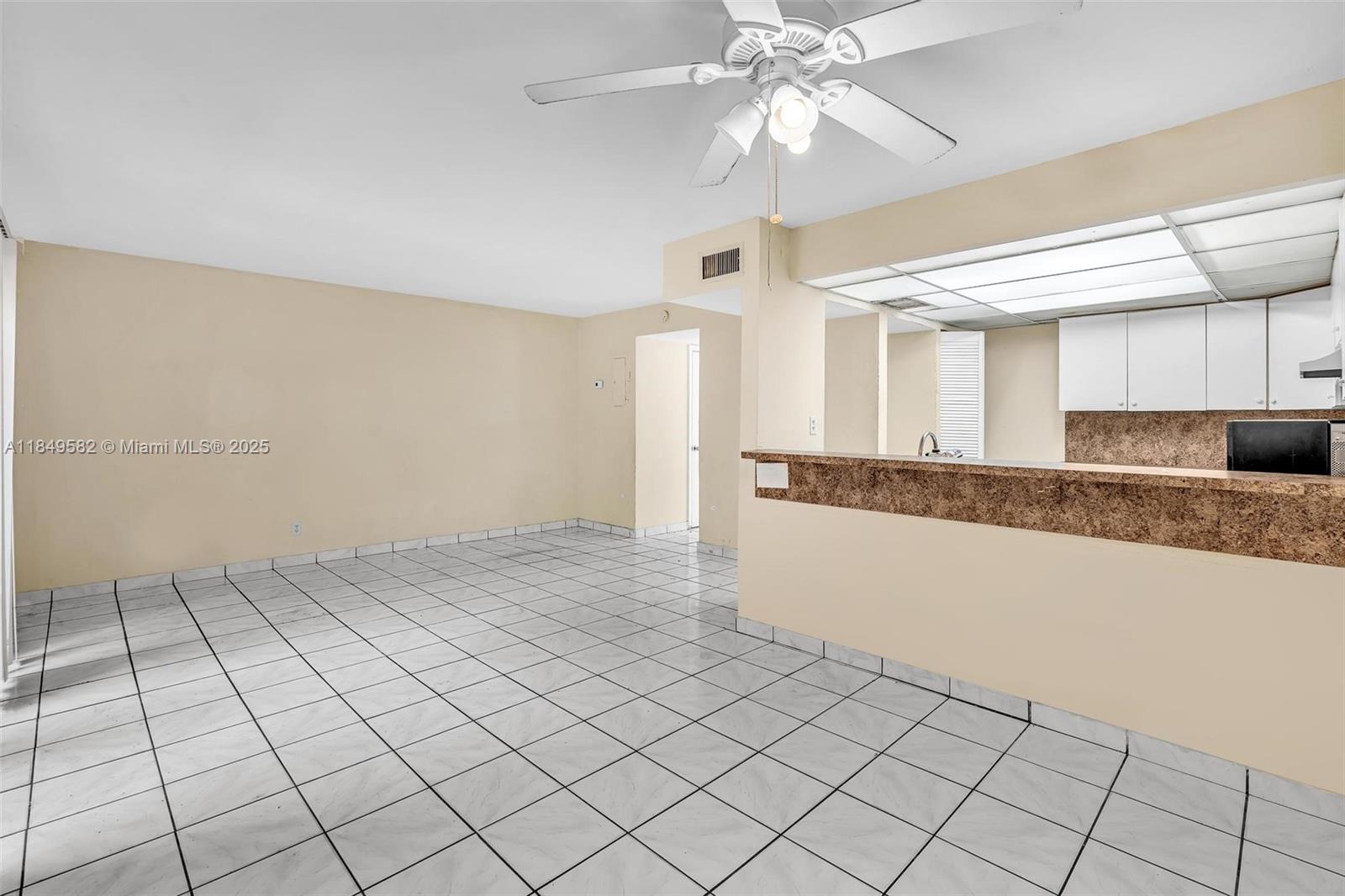 3750 Southwest 60th Terrace, Unit 1 Davie, FL 33314 - Photo 16 of 56 a view of a kitchen with a sink and a refrigerator cabinets