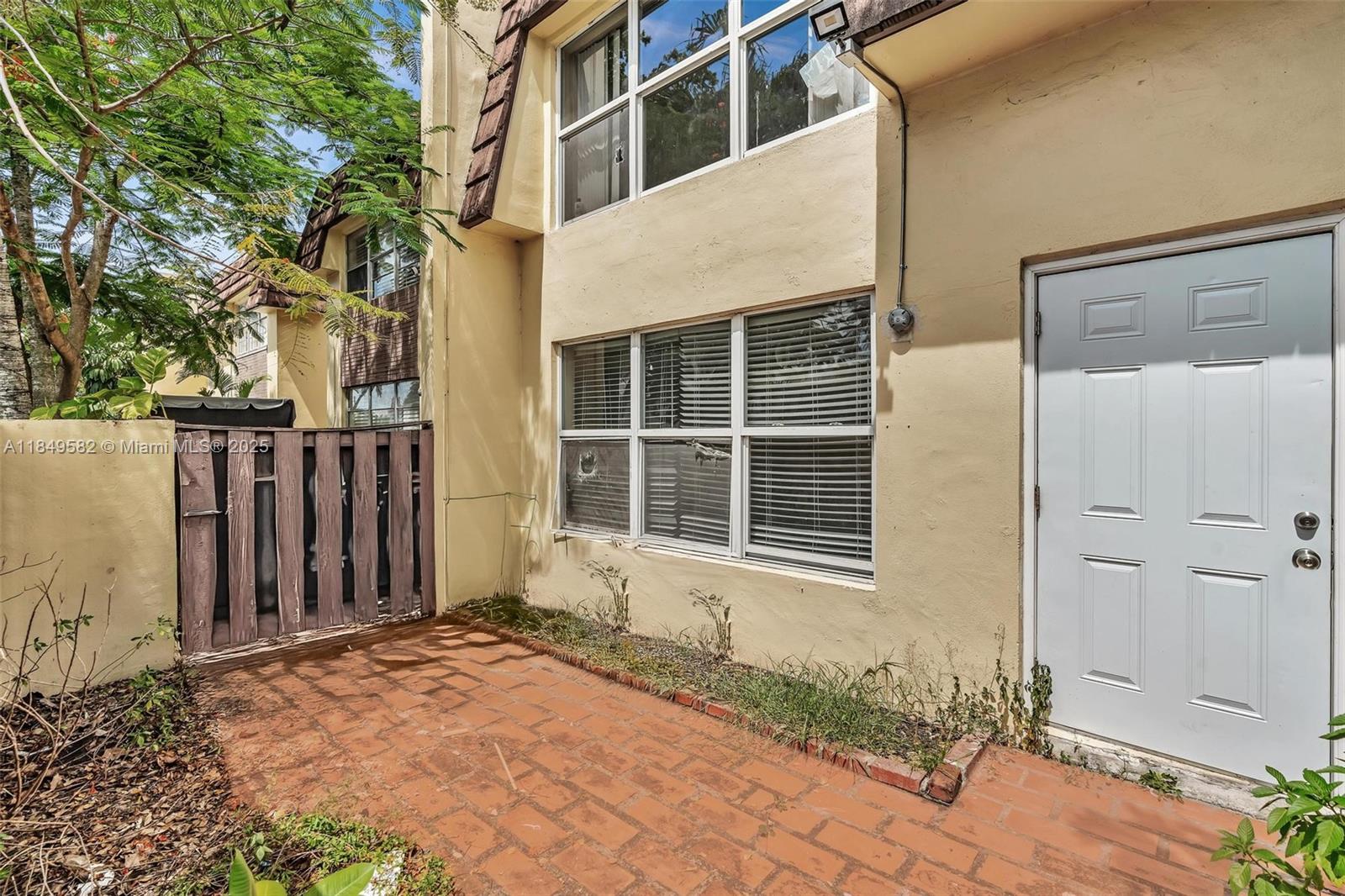 3750 Southwest 60th Terrace, Unit 1 Davie, FL 33314 - Photo 2 of 56 a view of a house with a tub