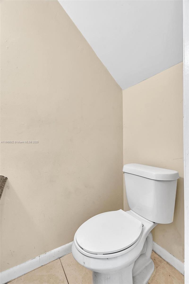 3750 Southwest 60th Terrace, Unit 1 Davie, FL 33314 - Photo 27 of 56 a white toilet sitting next to a white wall