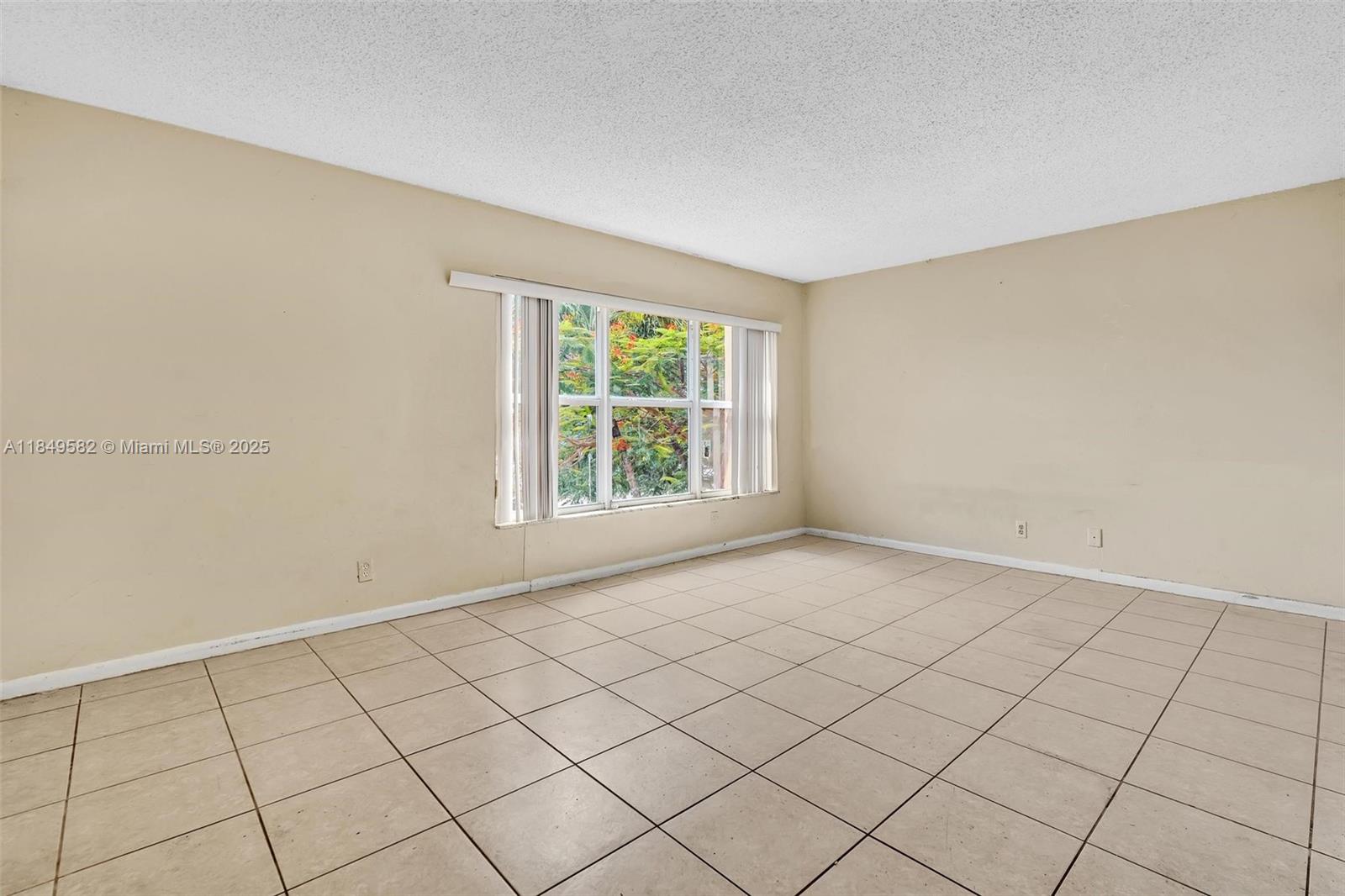 3750 Southwest 60th Terrace, Unit 1 Davie, FL 33314 - Photo 29 of 56 a view of an empty room and window