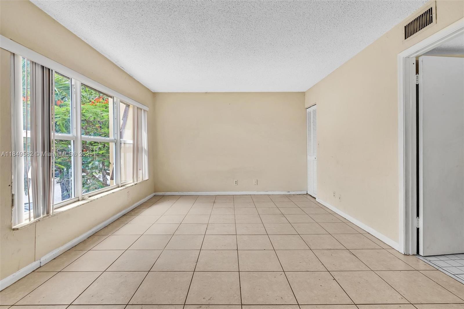 3750 Southwest 60th Terrace, Unit 1 Davie, FL 33314 - Photo 30 of 56 a view of an empty room and window