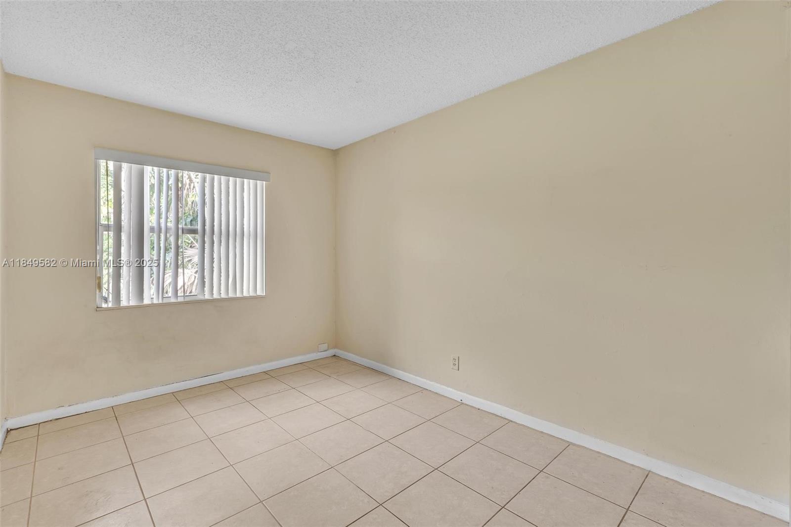 3750 Southwest 60th Terrace, Unit 1 Davie, FL 33314 - Photo 36 of 56 an empty room with windows