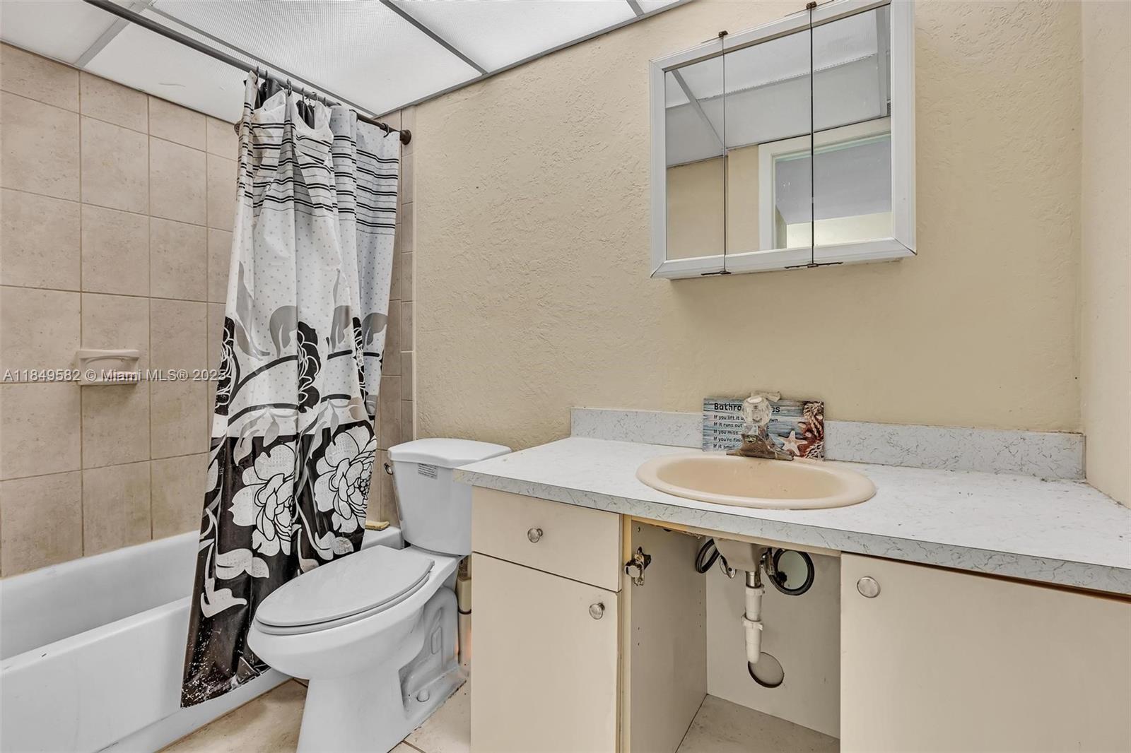 3750 Southwest 60th Terrace, Unit 1 Davie, FL 33314 - Photo 43 of 56 a bathroom with a sink a toilet and shower