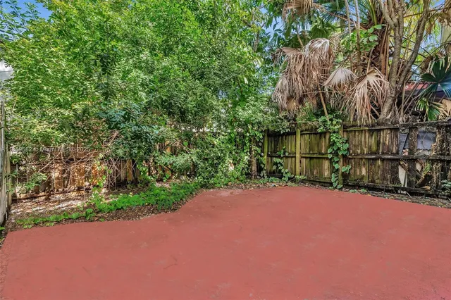 an aerial view of residential houses with city view