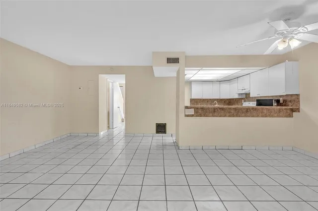 an aerial view of residential building with green space