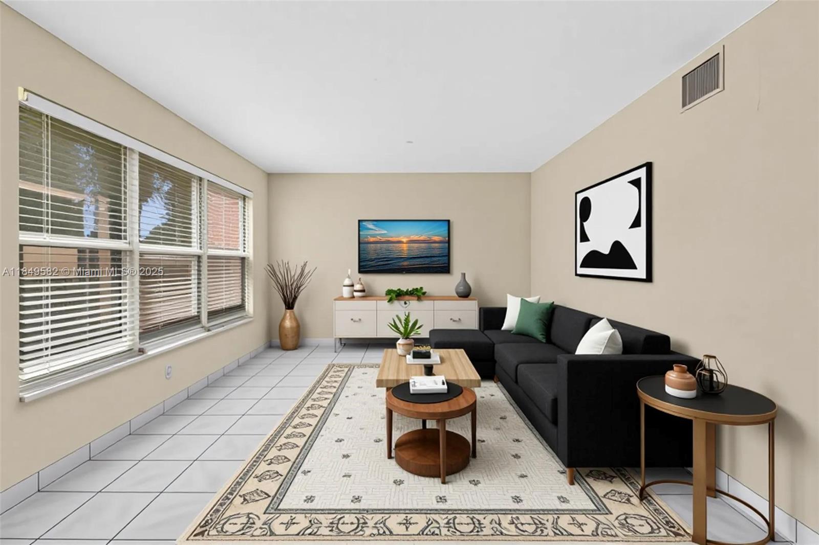 3750 Southwest 60th Terrace, Unit 1 Davie, FL 33314 - Photo 5 of 56 a living room with furniture and a flat screen tv