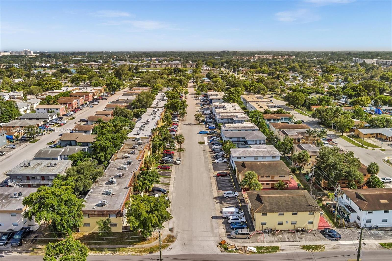 3750 Southwest 60th Terrace, Unit 1 Davie, FL 33314 - Photo 52 of 56 an aerial view of residential building with parking space