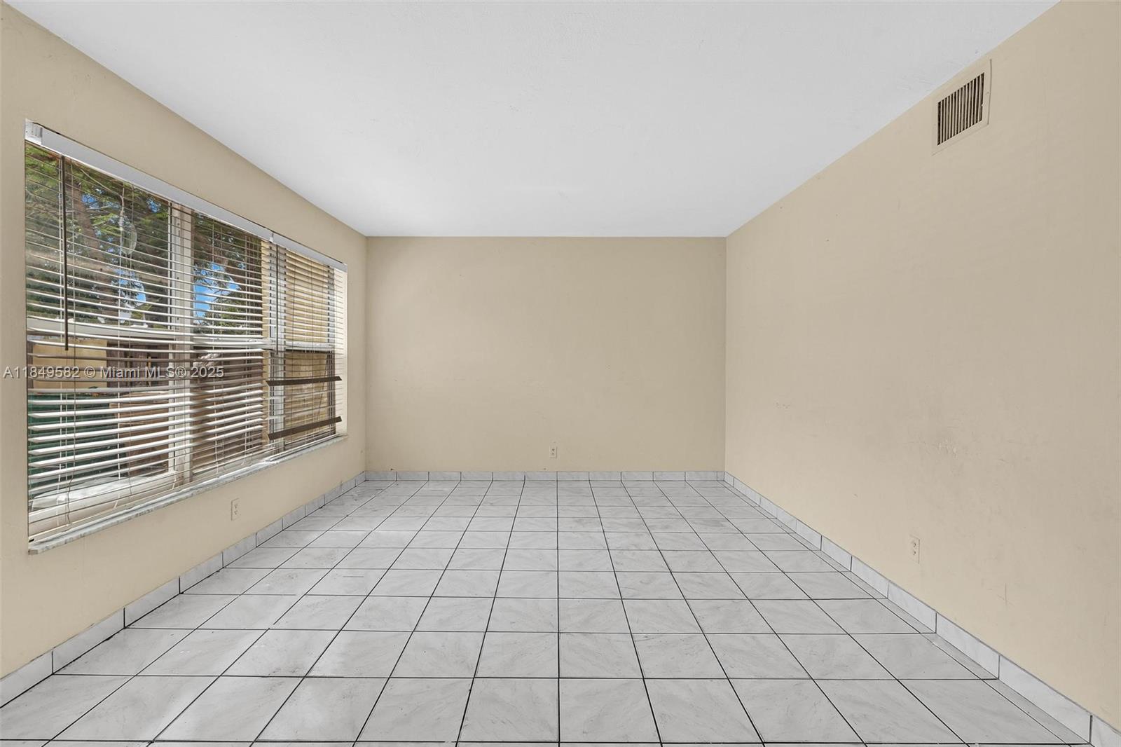 3750 Southwest 60th Terrace, Unit 1 Davie, FL 33314 - Photo 6 of 56 a view of an empty room and window