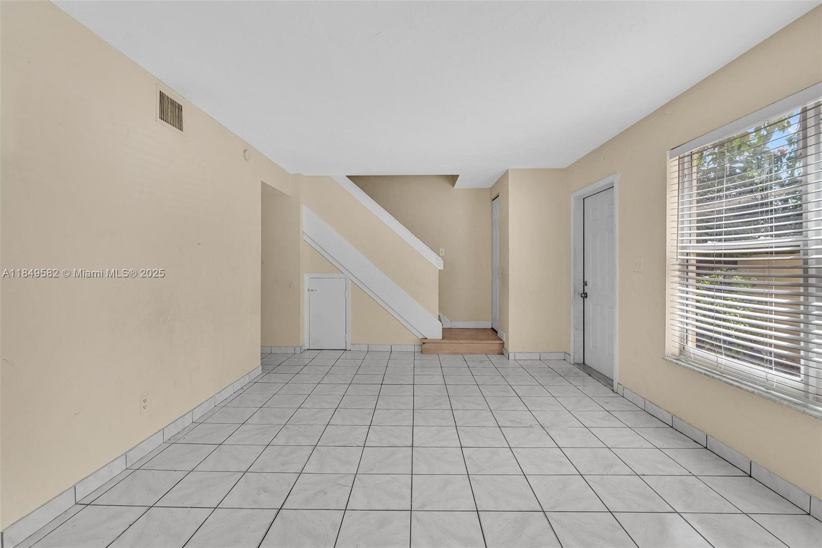 3750 Southwest 60th Terrace, Unit 1 Davie, FL 33314 - Photo 8 of 56 a view of an empty room with window