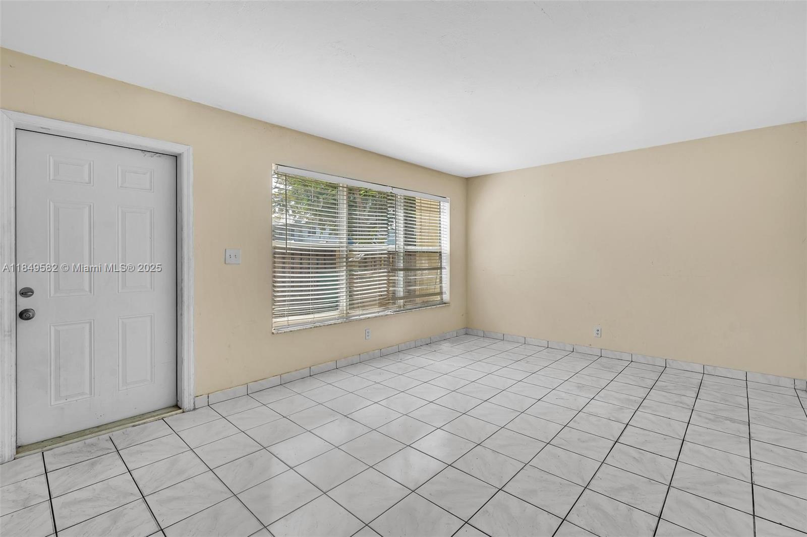 3750 Southwest 60th Terrace, Unit 1 Davie, FL 33314 - Photo 10 of 56 a view of an empty room and window