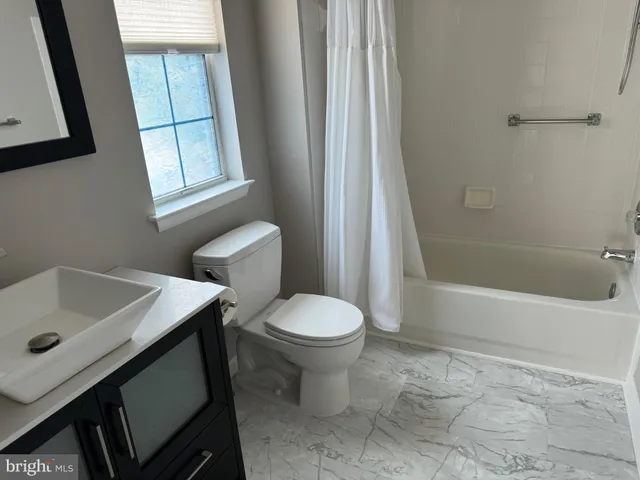 a bathroom with a sink a vanity and a mirror