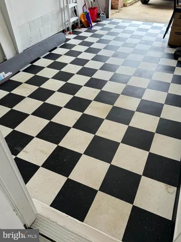 a room with black white and black white checkered floor