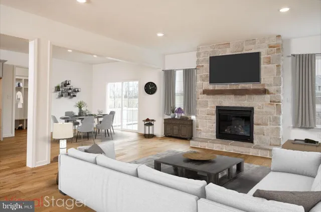 a living room with furniture fireplace and flat screen tv