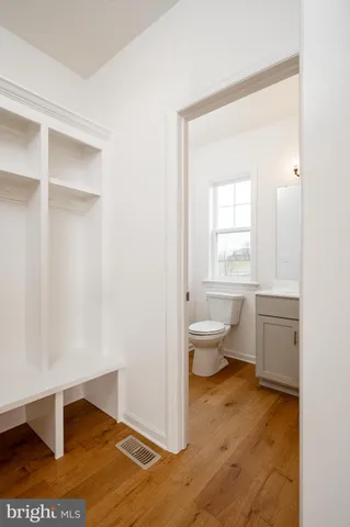 a bathroom with a toilet sink and a window
