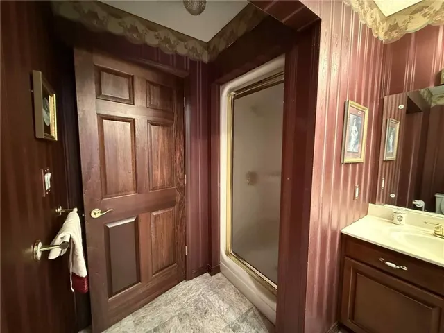 a bathroom with a tub and shower
