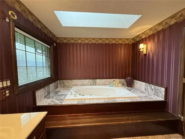 a bed room with furniture and a lamp