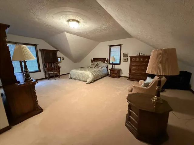 a living room with furniture a piano and a flat screen tv