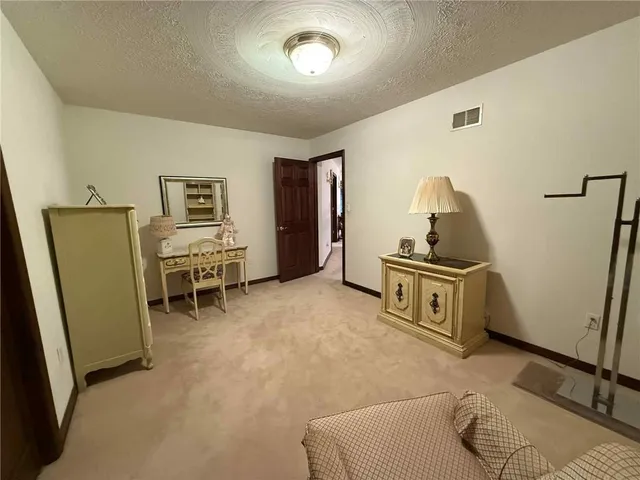 a view of a livingroom with furniture and windows