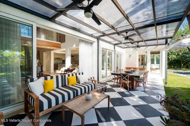 a view of a house with swimming pool and a yard