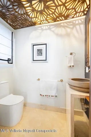 a bedroom with a bed and a view of bathroom