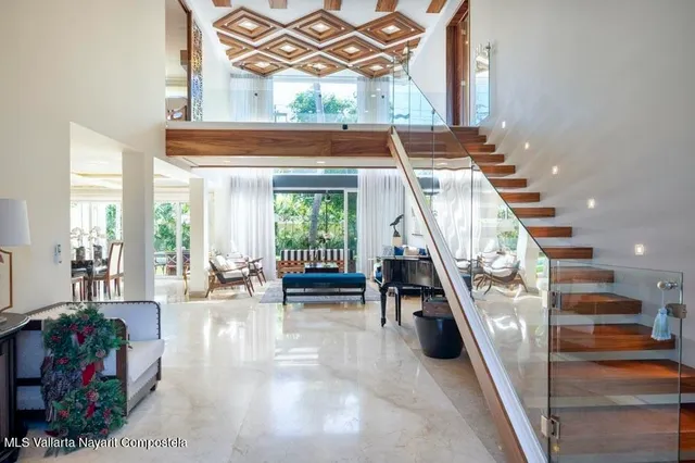 a room with lots of furniture and air hockey table