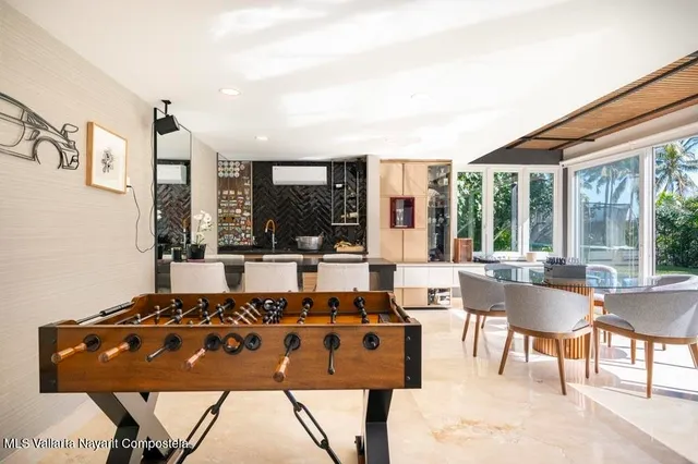 a view of a patio with table and chairs