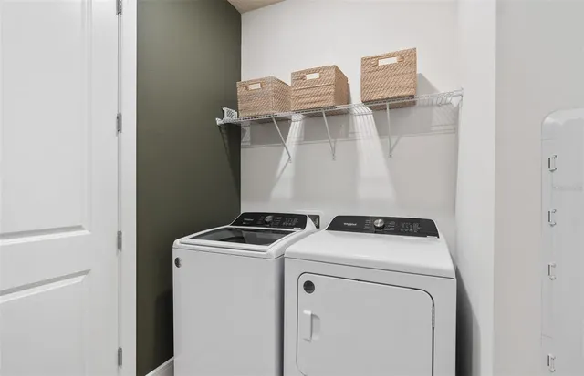 a utility room with dryer and washer