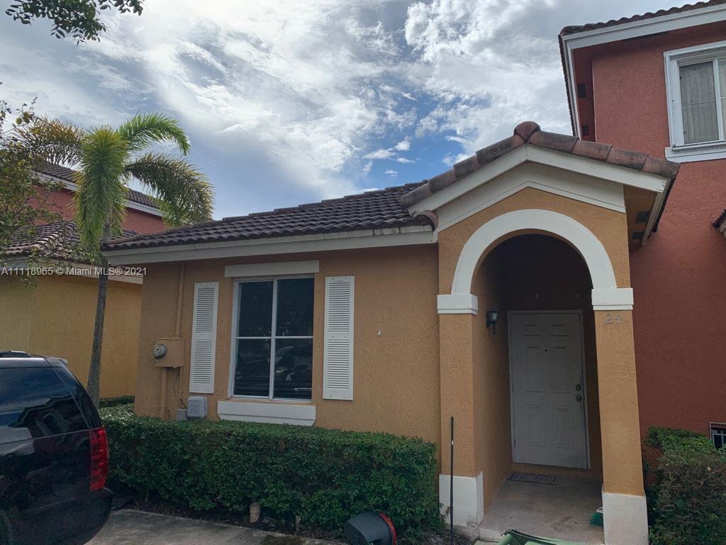 24 Southwest 15th Road Homestead, FL 33030 - Photo 1 of 1 a front view of a house with a garden