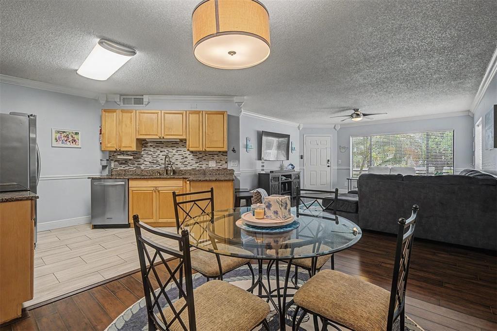 1550 South Belcher Road, Unit 525 Clearwater, FL 33764 - Photo 14 of 28 a view of a dining room with furniture and wooden floor