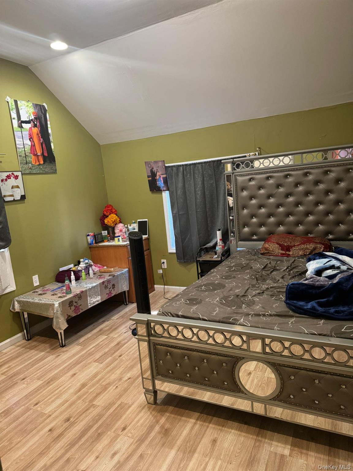 101-34 126th Street Queens, NY 11419 - Photo 7 of 8 a bedroom with a bed and gym equipment