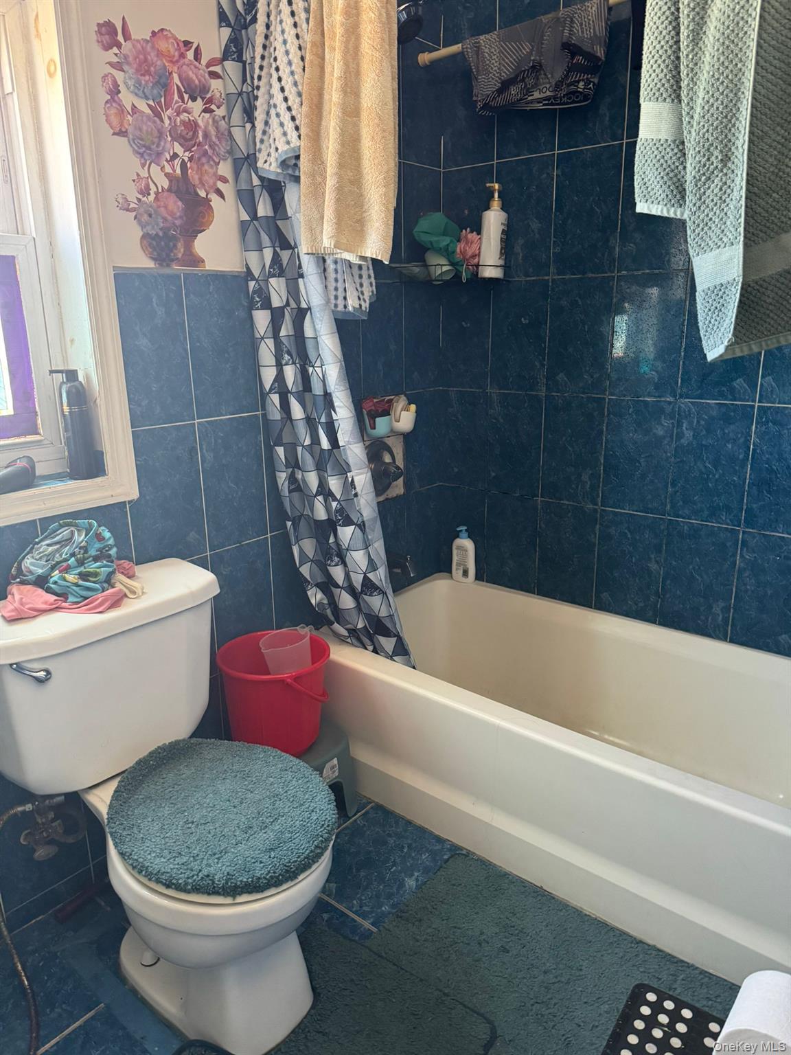 101-34 126th Street Queens, NY 11419 - Photo 8 of 8 a white bath tub sitting next to a white toilet