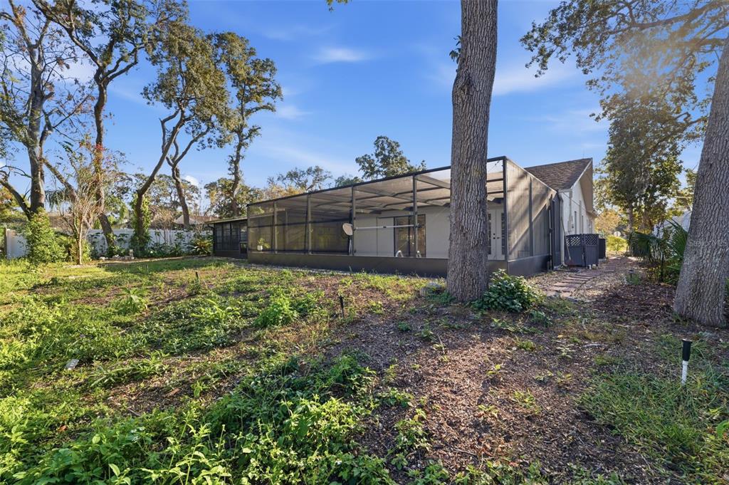 7822 Holiday Drive Spring Hill, FL 34606 - Photo 29 of 51 a view of a backyard