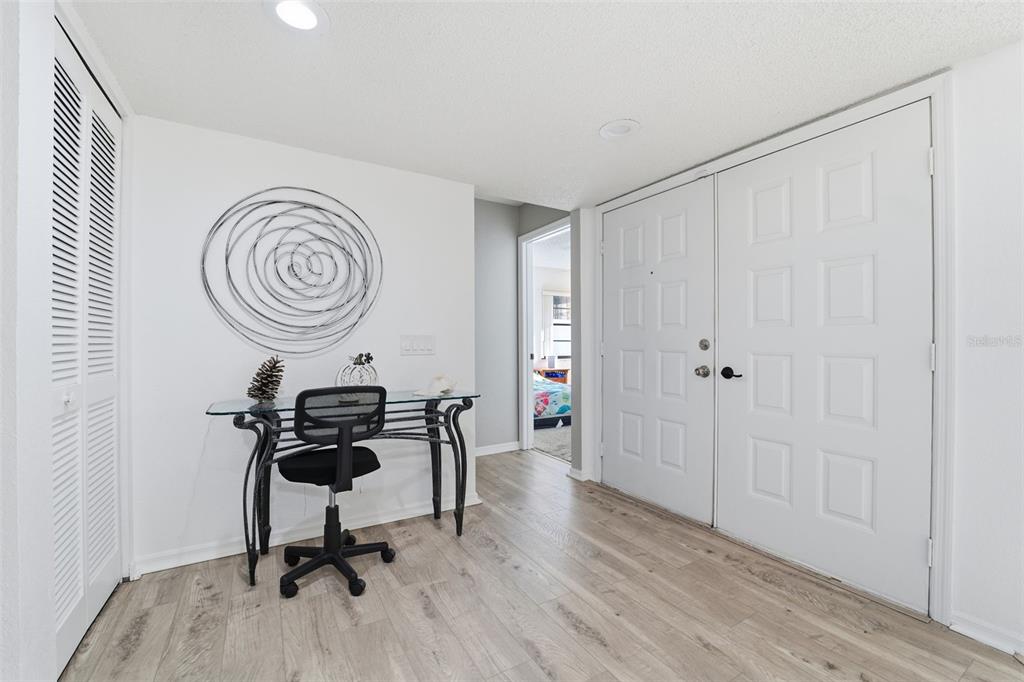 7822 Holiday Drive Spring Hill, FL 34606 - Photo 3 of 51 a view of a workspace with furniture and wooden floor