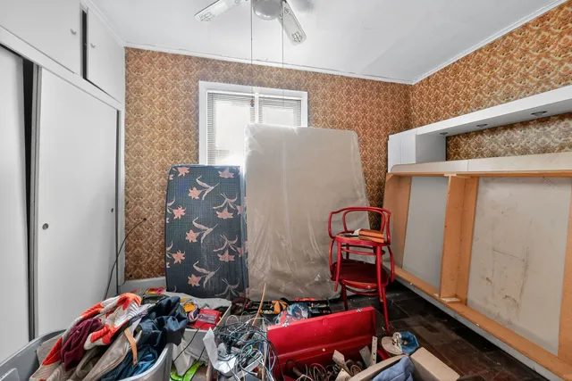 a bedroom with a bed and furniture