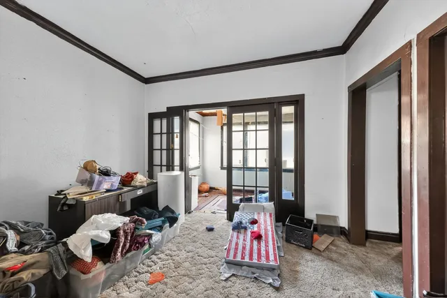 a bed room with a bed and a window