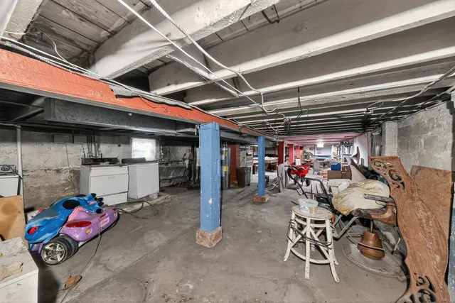 a car and bike parked in a garage