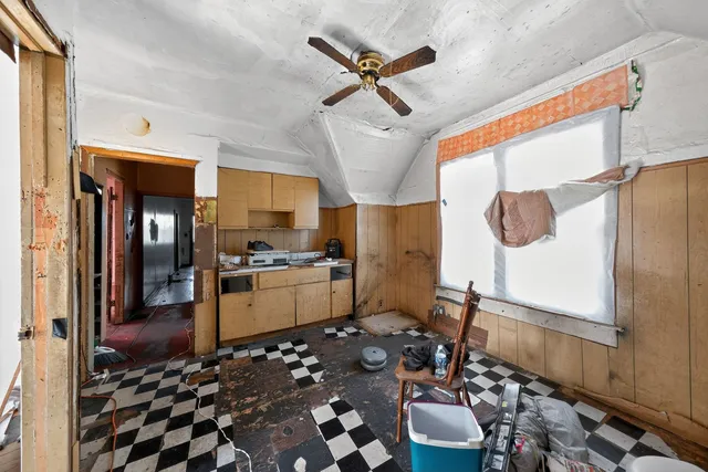a kitchen with granite countertop a sink appliances and cabinets