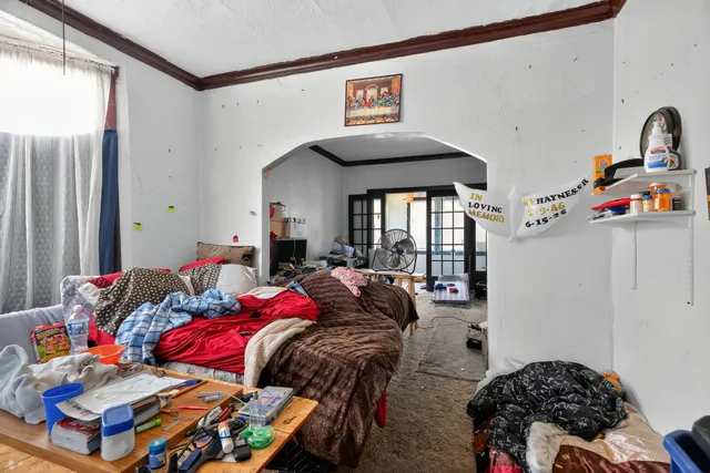 a bedroom with bed and a window