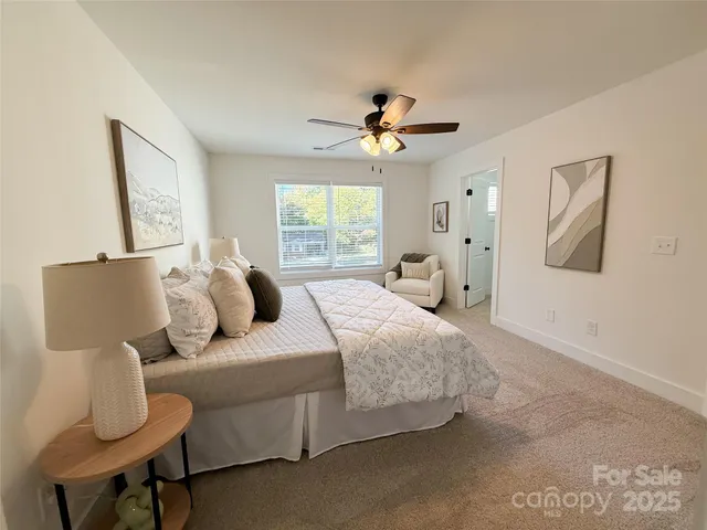 a bedroom with bed and window