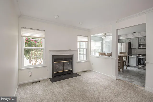 a view of kitchen with furniture and a fireplace